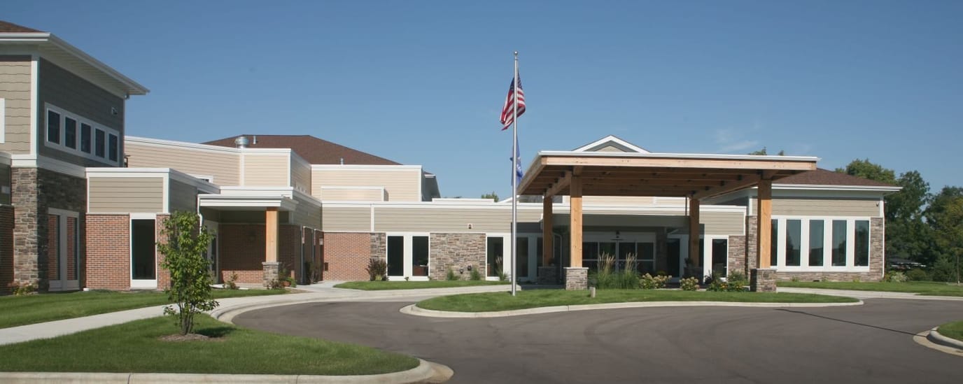 Oak Park Place Madison East, nursing home in Madison, WI — Senior living facility entrance with landscaped surroundings