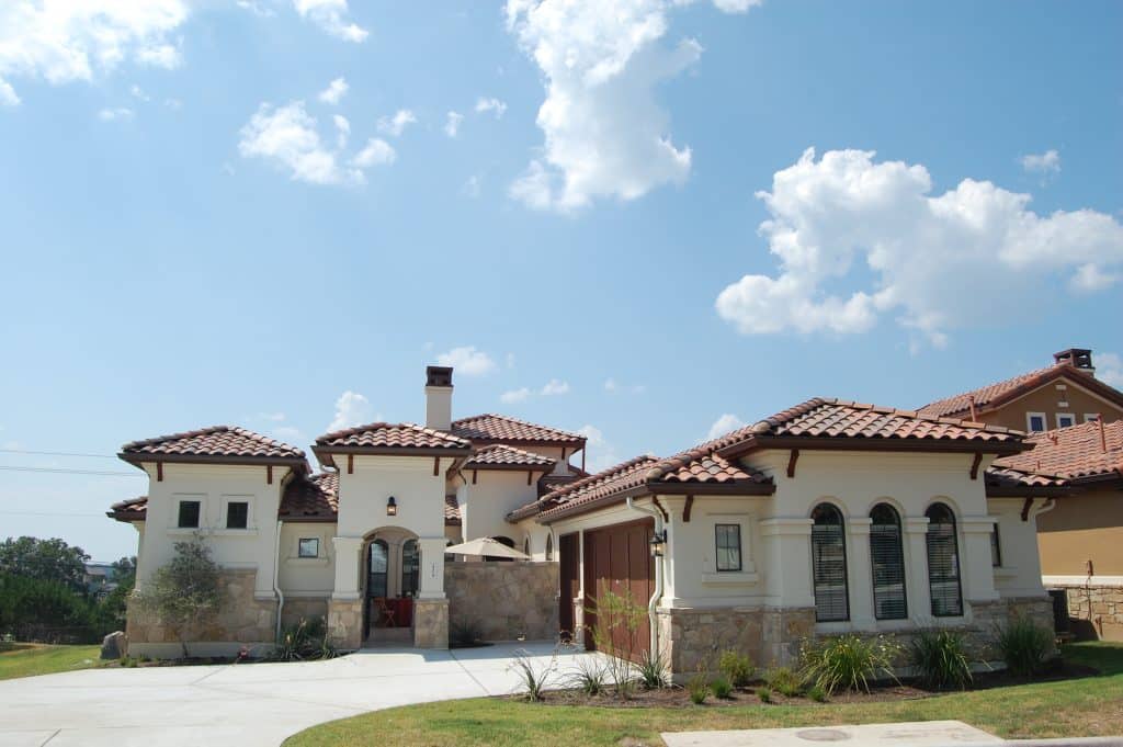 Exterior view of a senior living facility with gardens