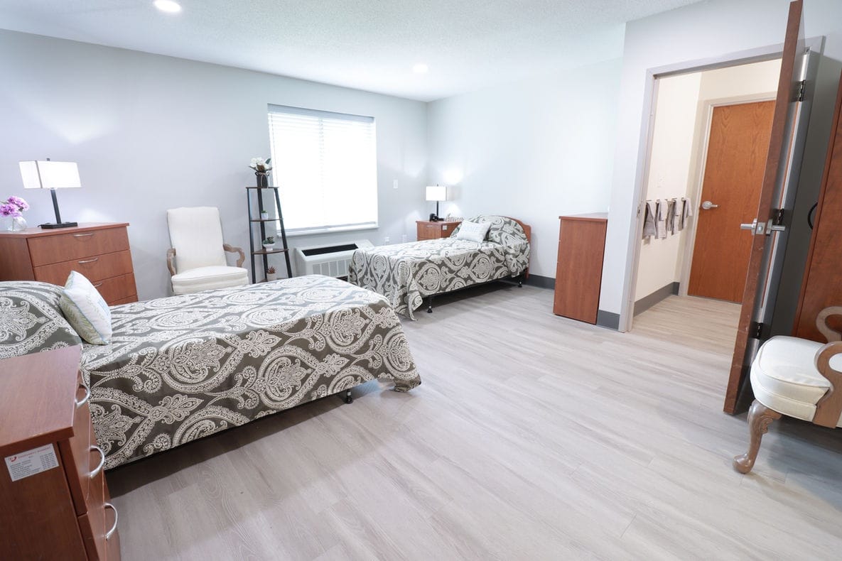 Spacious and well-lit resident room with two beds