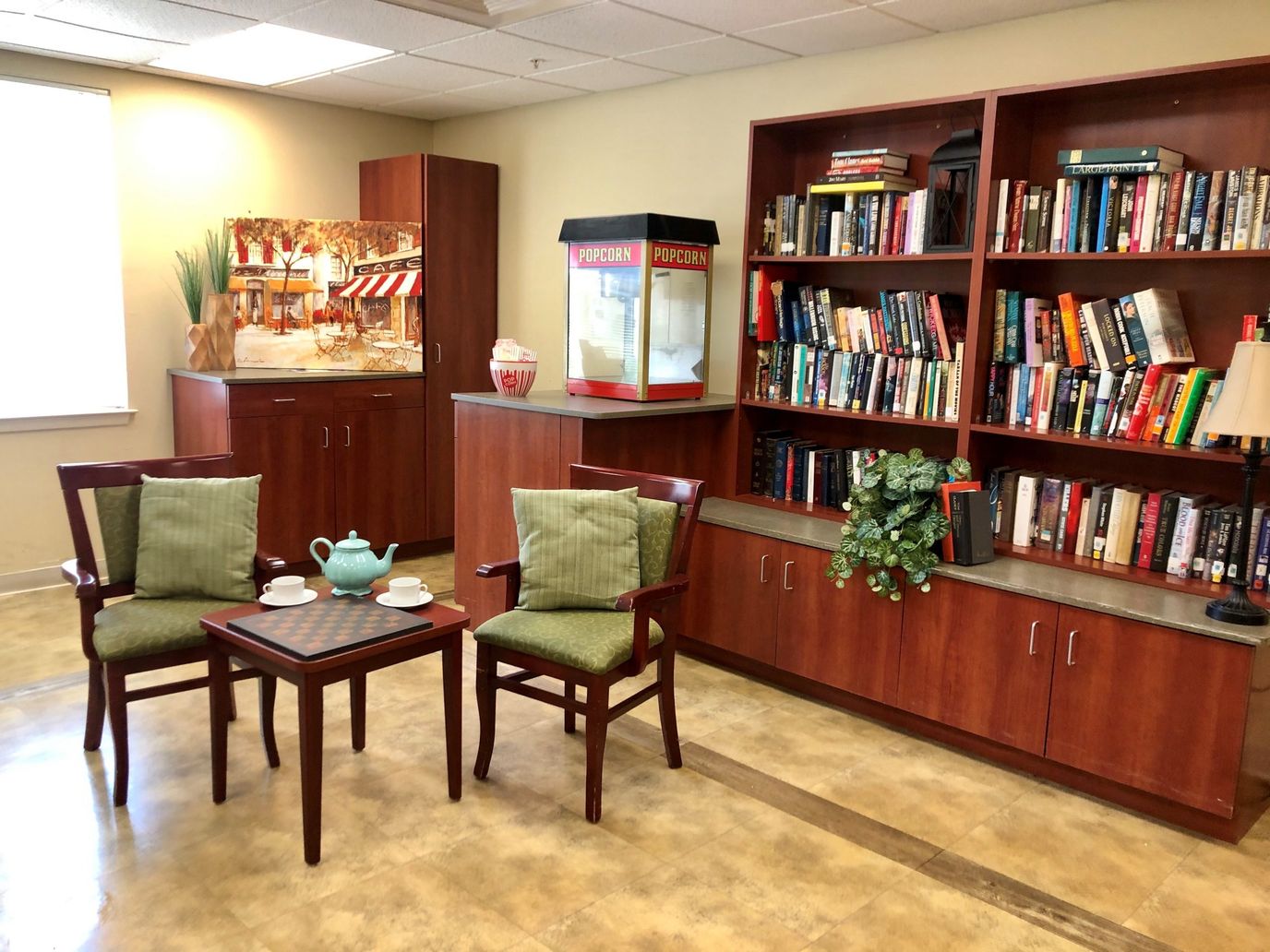 Cozy common area with bookshelf and seating