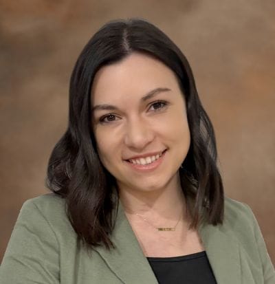Dove Healthcare – West Eau Claire, Nursing Home in Eau Claire, WI — Portrait of a young woman smiling in a professional setting