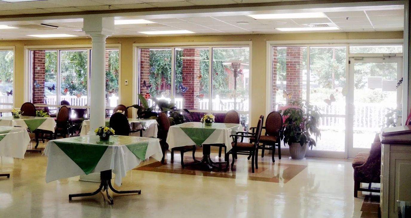Dining room with tables set for meals.