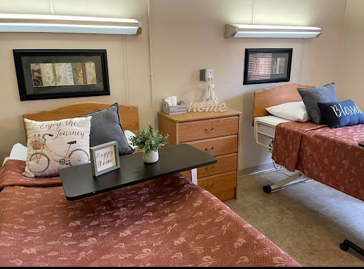 Cozy resident room with two beds and homey decor