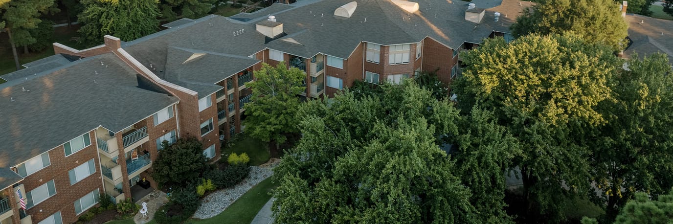 Aerial view of a senior living community with gardens