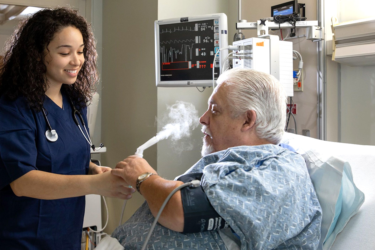 Nurse assisting a patient in a hospital room