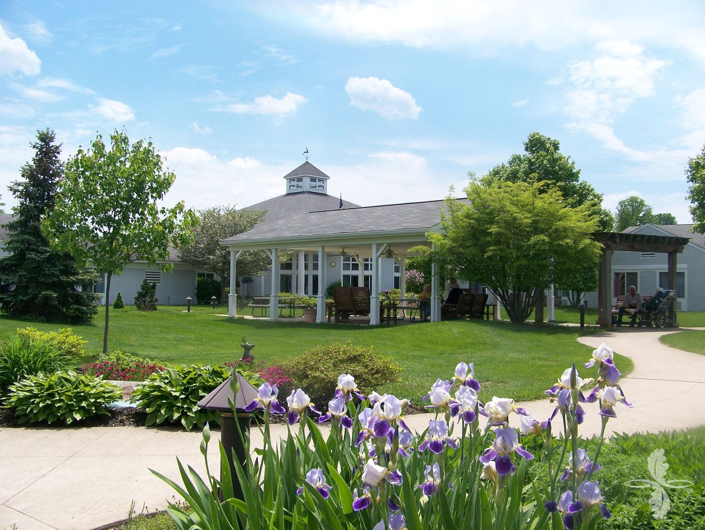 Well-maintained outdoor space with flowers and building