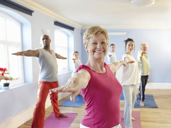 Residents participating in a yoga class indoors
