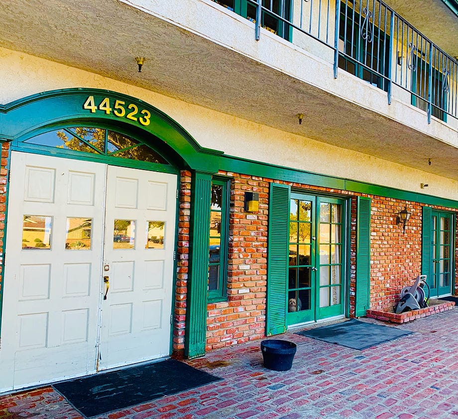 Exterior view of the facility entrance with brick facade