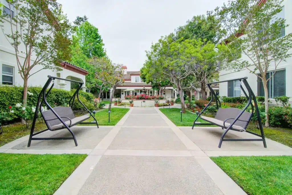Pathway with seating in a landscaped garden area