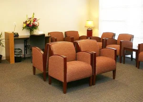 Seating area in a waiting room with flowers