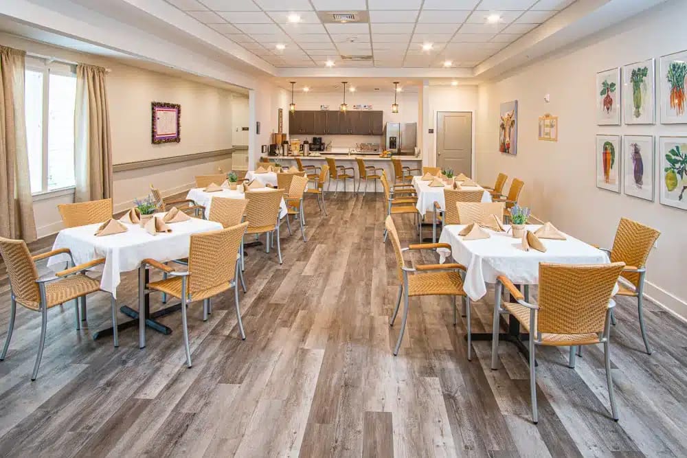 Bright dining room with tables set for meals