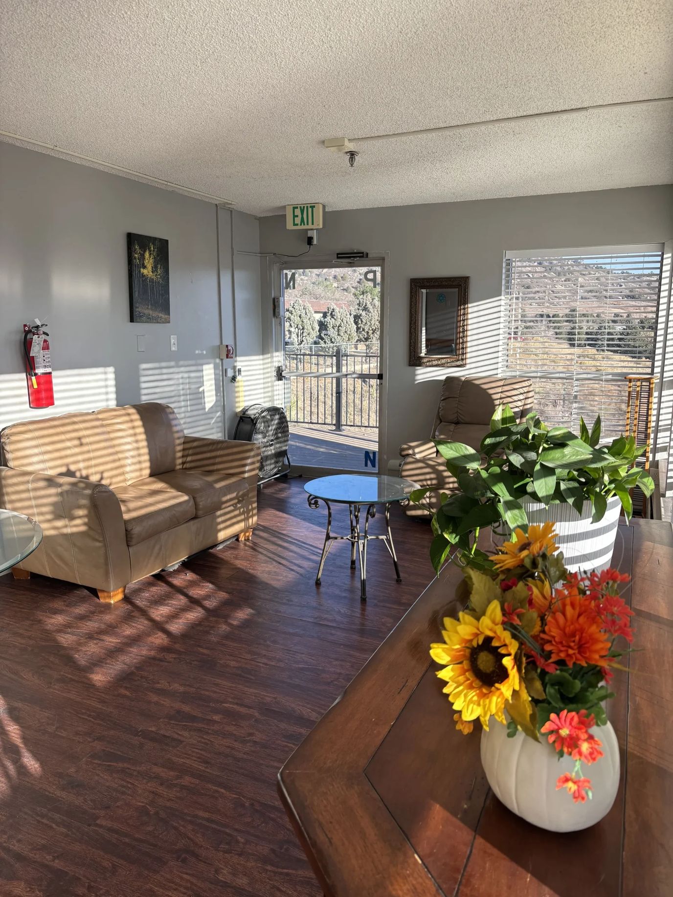 Bright common area with seating and flowers