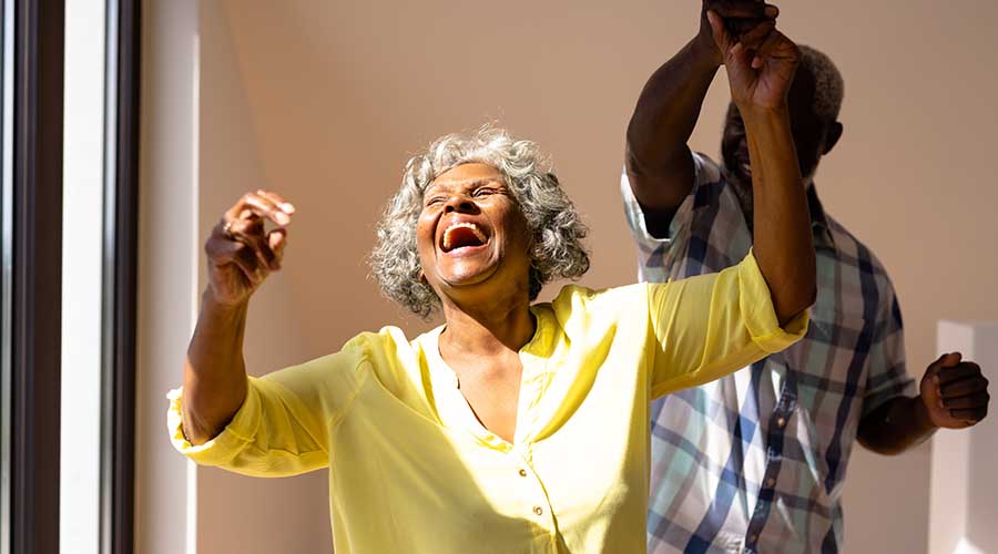 Residents enjoying a joyful moment indoors.