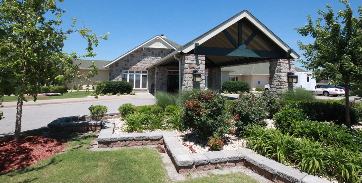 Exterior view of the facility entrance with landscaping