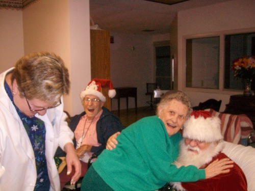 Residents celebrating with Santa in a festive common area