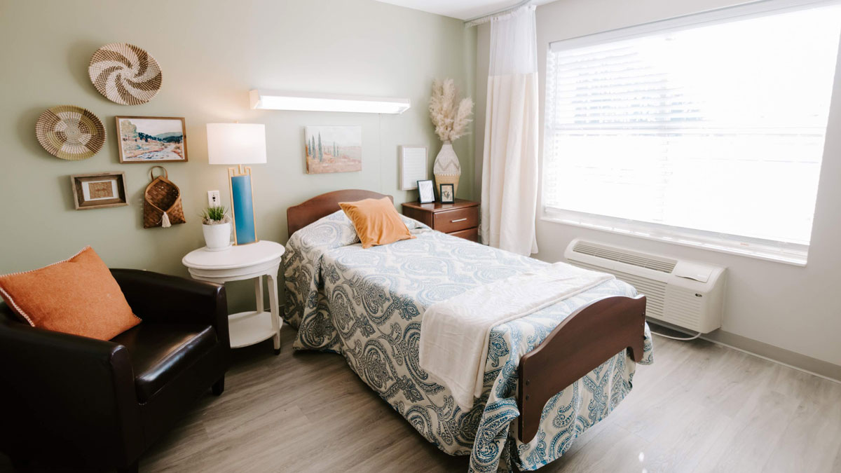 Cozy resident room with bed and seating area