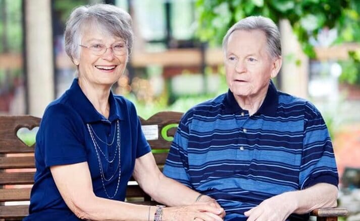 A senior couple enjoying time together on a bench