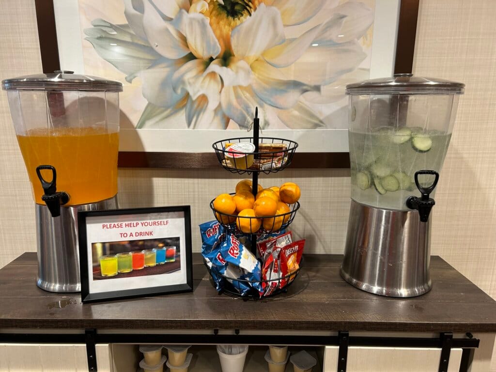 Drink station with beverages and snacks available.