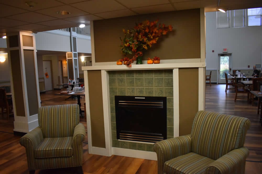 Cozy seating area with a fireplace in a common room