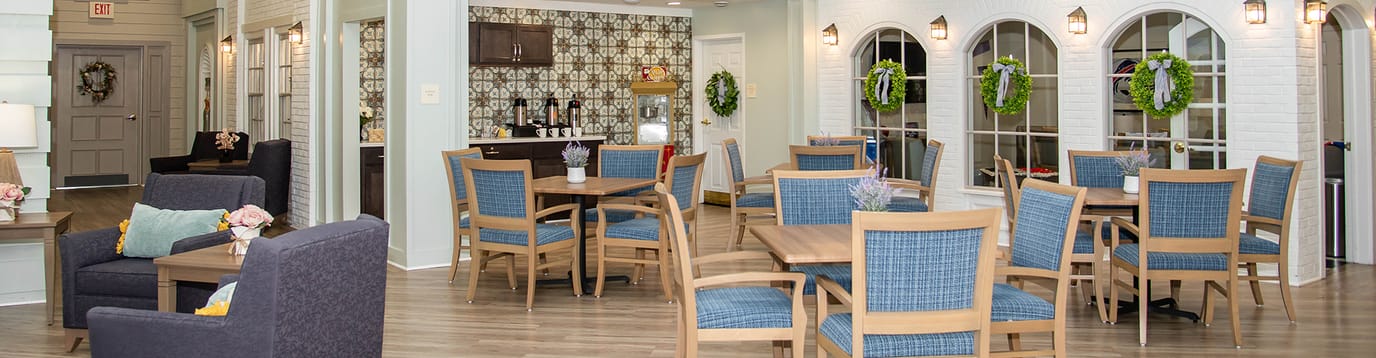 Common area with tables, chairs, and decor