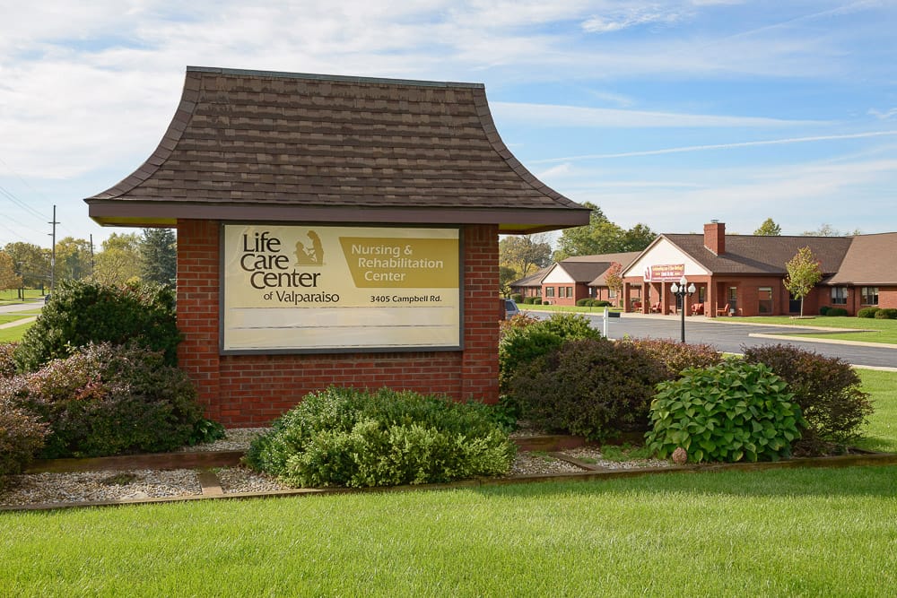 Exterior view of Life Care Center with signage