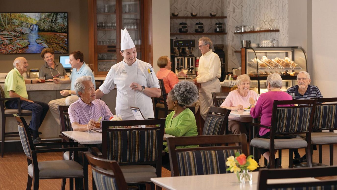 Residents enjoying a meal in the dining area