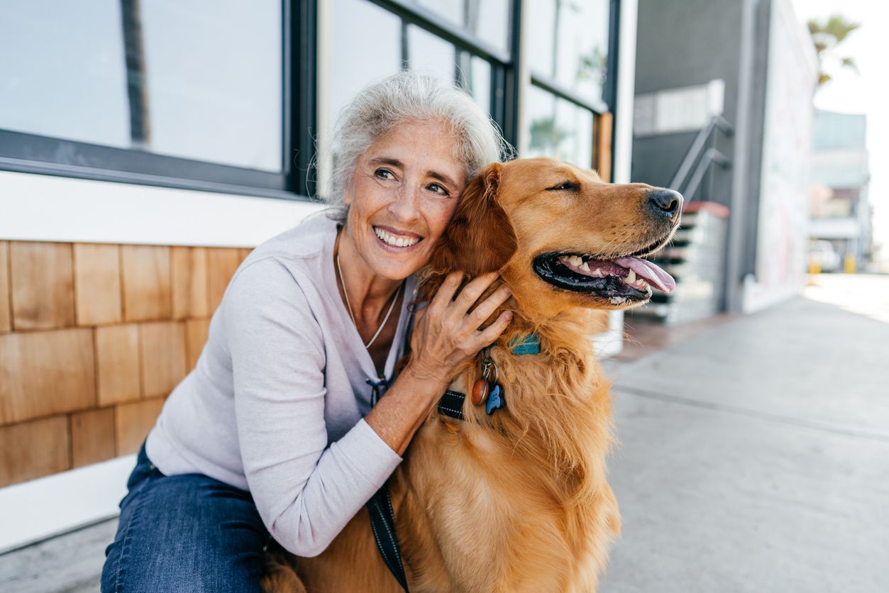 Resident enjoying time with a golden retriever