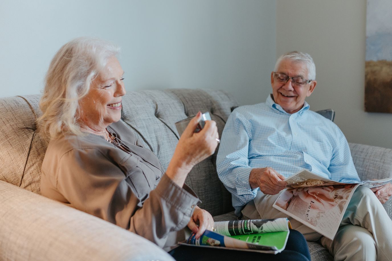 Two residents enjoying time together in a cozy sitting area