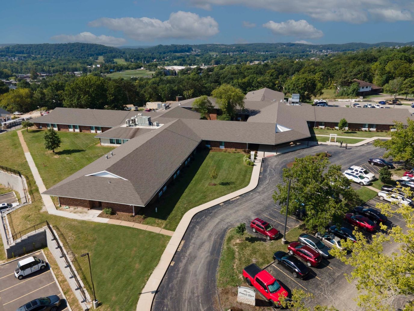 Aerial view of the assisted living facility with landscaped grounds