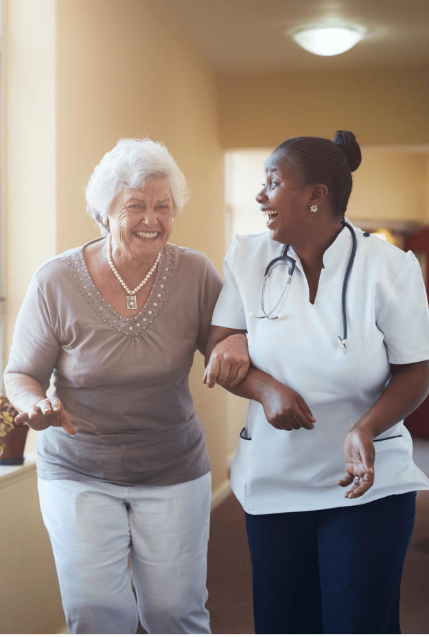 Caregiver and resident laughing together