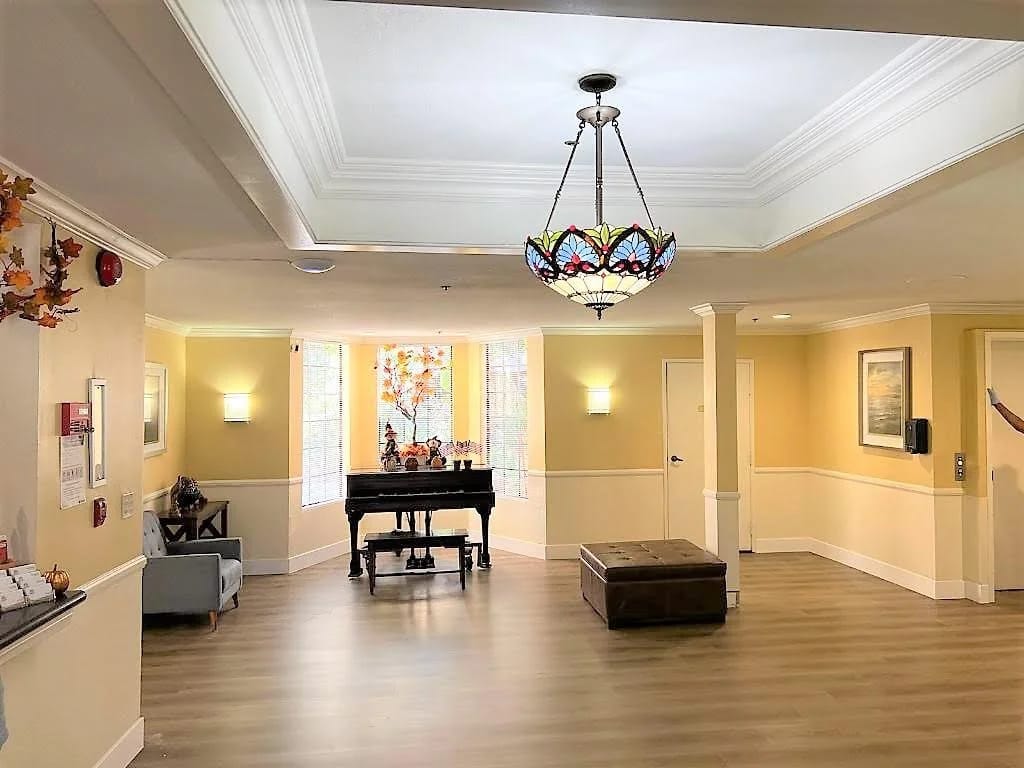 Interior view of a common area with a piano