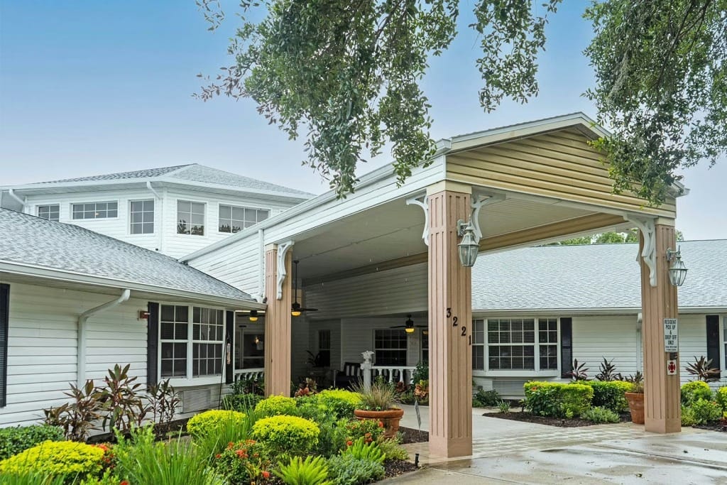 Entrance of a senior living facility with landscaping