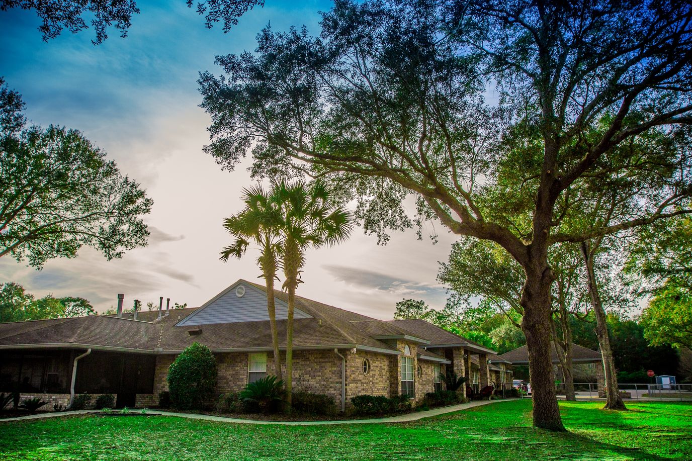 Exterior view of Berryhill Manor surrounded by trees