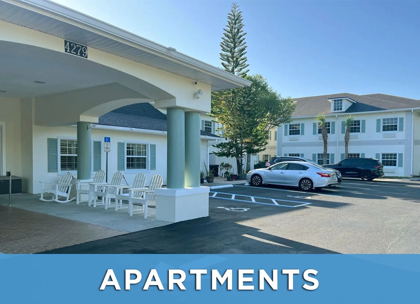 Exterior view of a senior living facility with parking