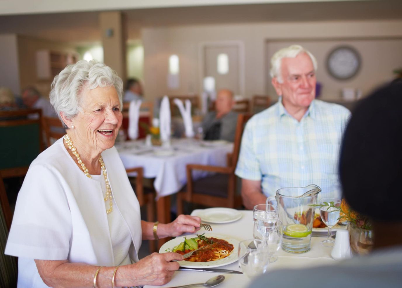 Residents enjoying a meal in the dining room