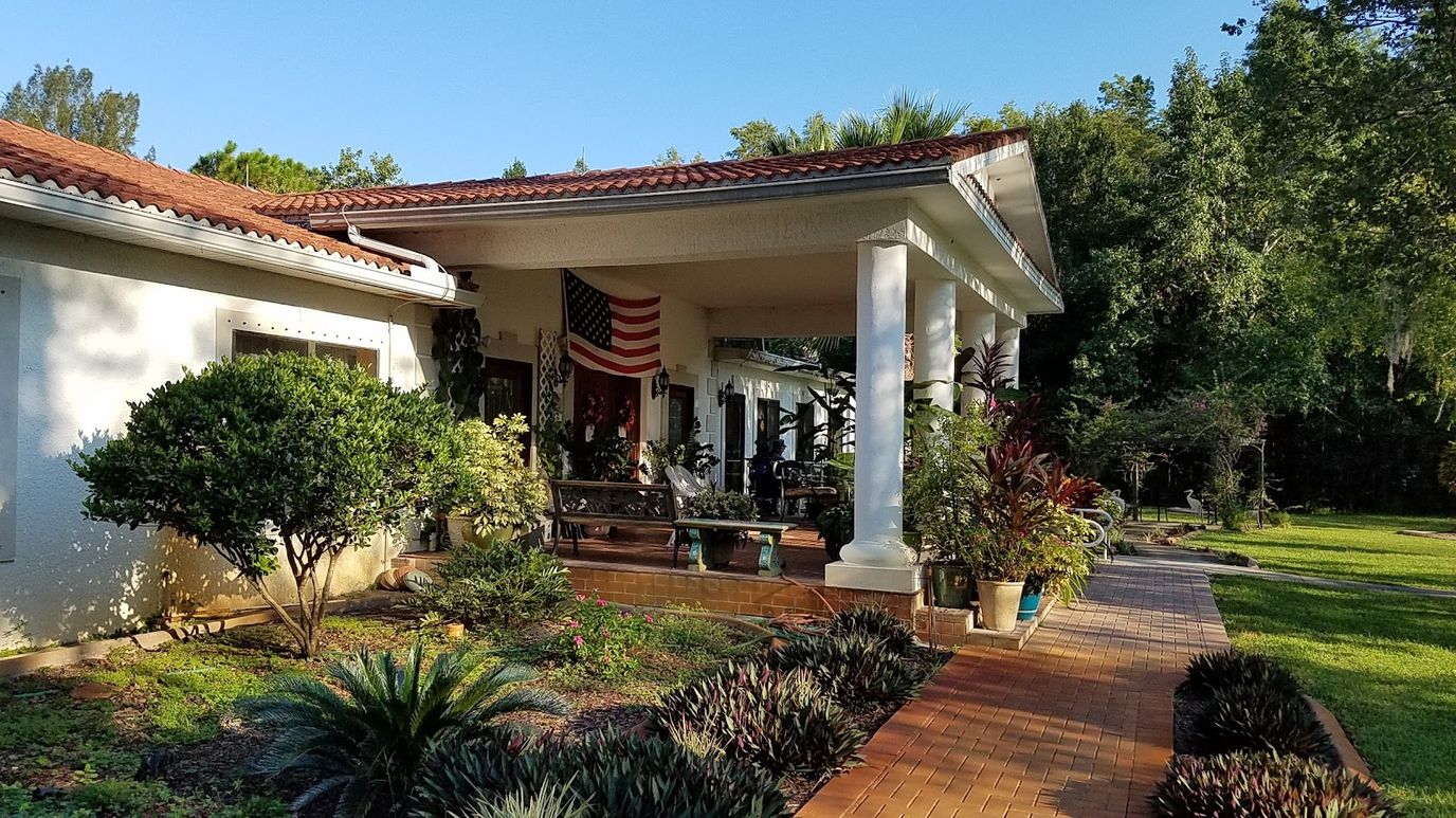 Exterior view of East Lake Manor with garden