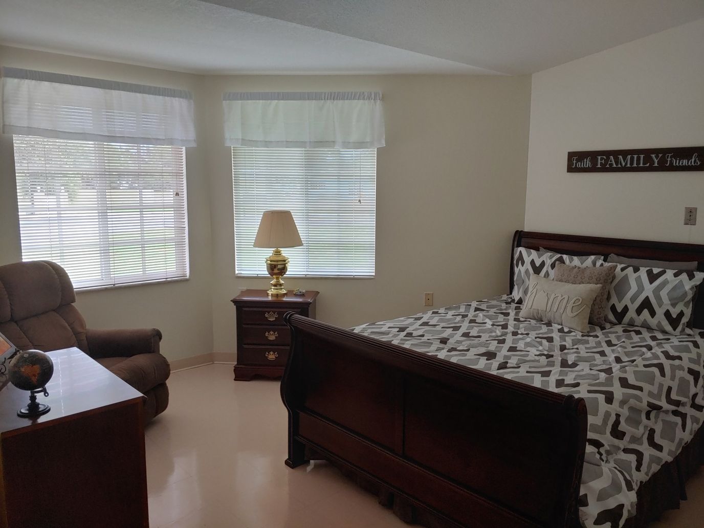 Cozy private room with a bed and armchair
