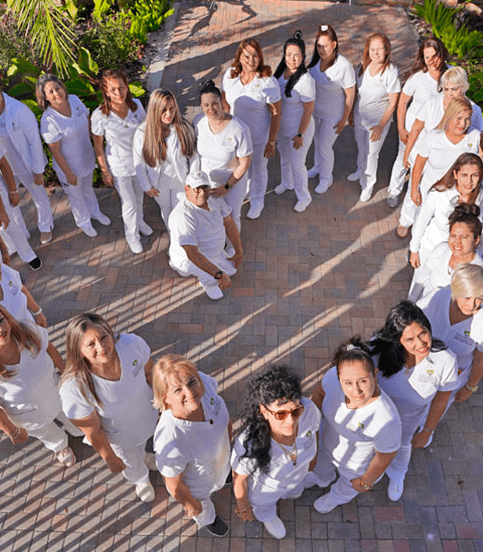 Group of staff members posing in an outdoor area
