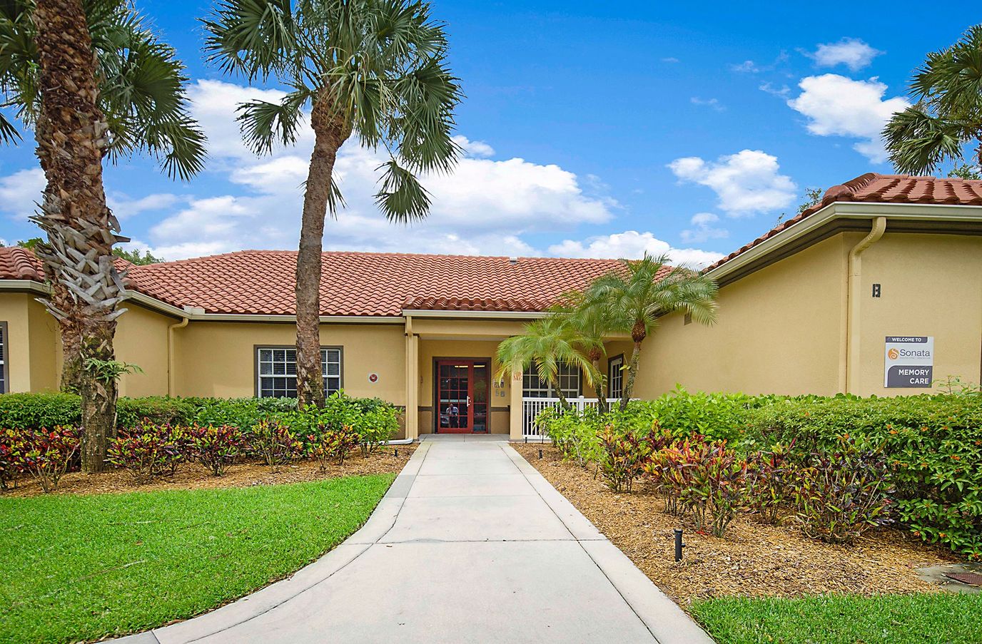Exterior view of Sonata Boca Raton with landscaped pathway