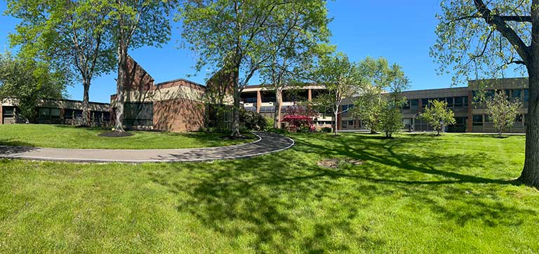 Exterior view of Trinity Community with landscaping
