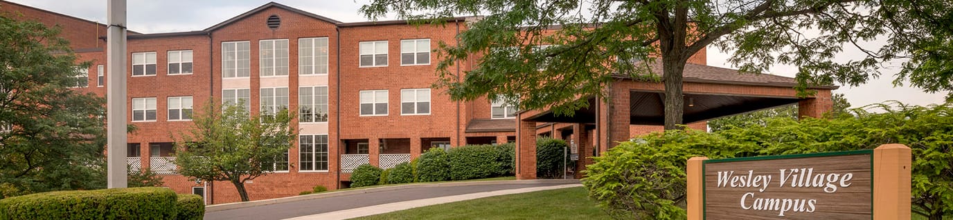Wesley Village, Nursing Home in Pittston, PA — Exterior view of Wesley Village building with landscaped entrance