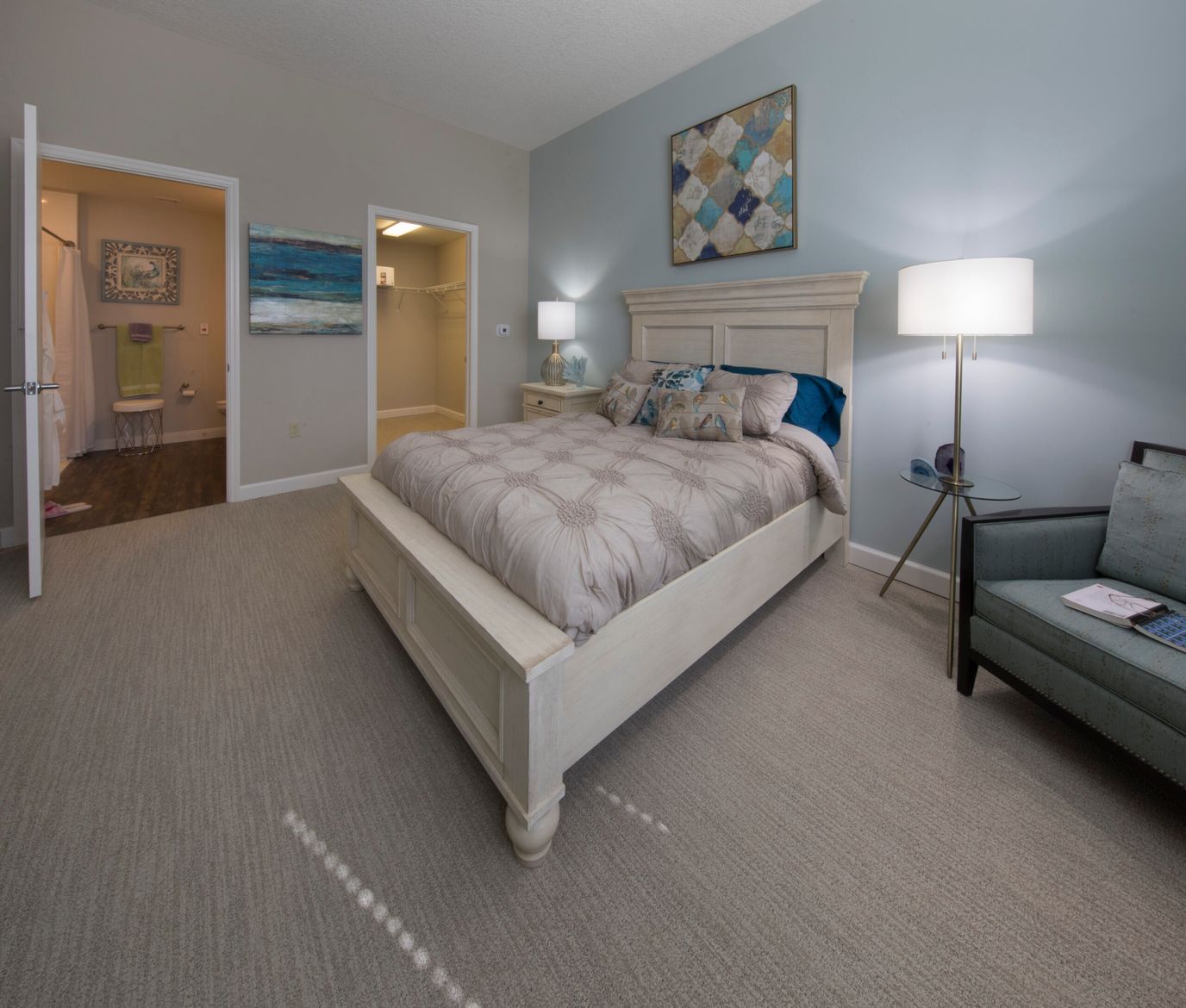 Well-furnished private resident room with bed and seating area