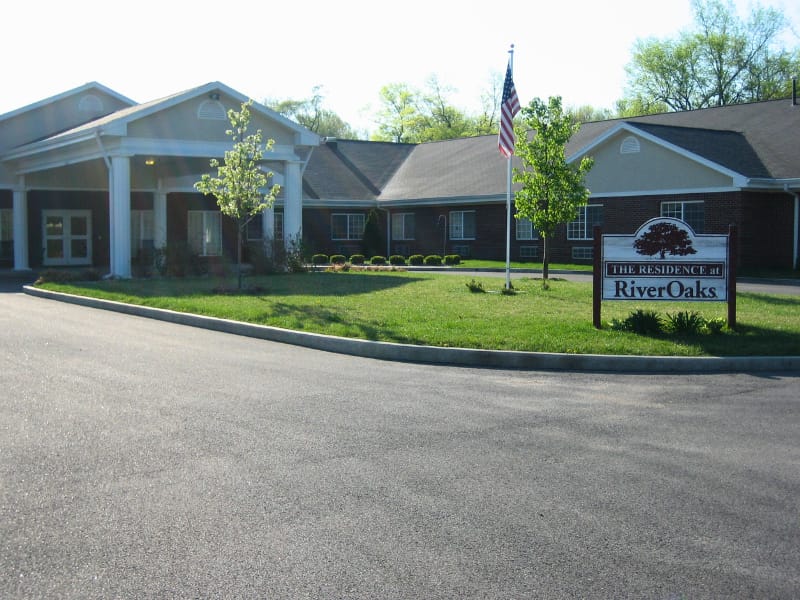 Front exterior of a senior living facility with landscaping