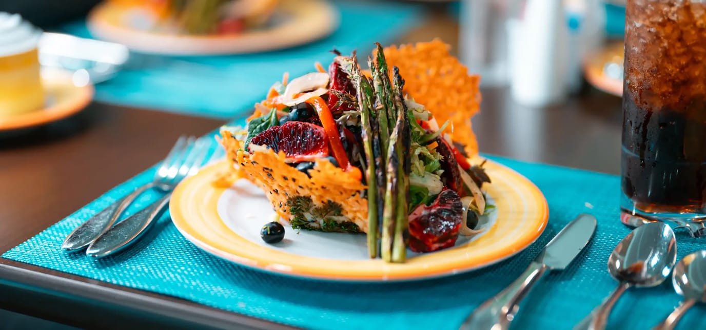 A beautifully presented salad dish on a dining table.