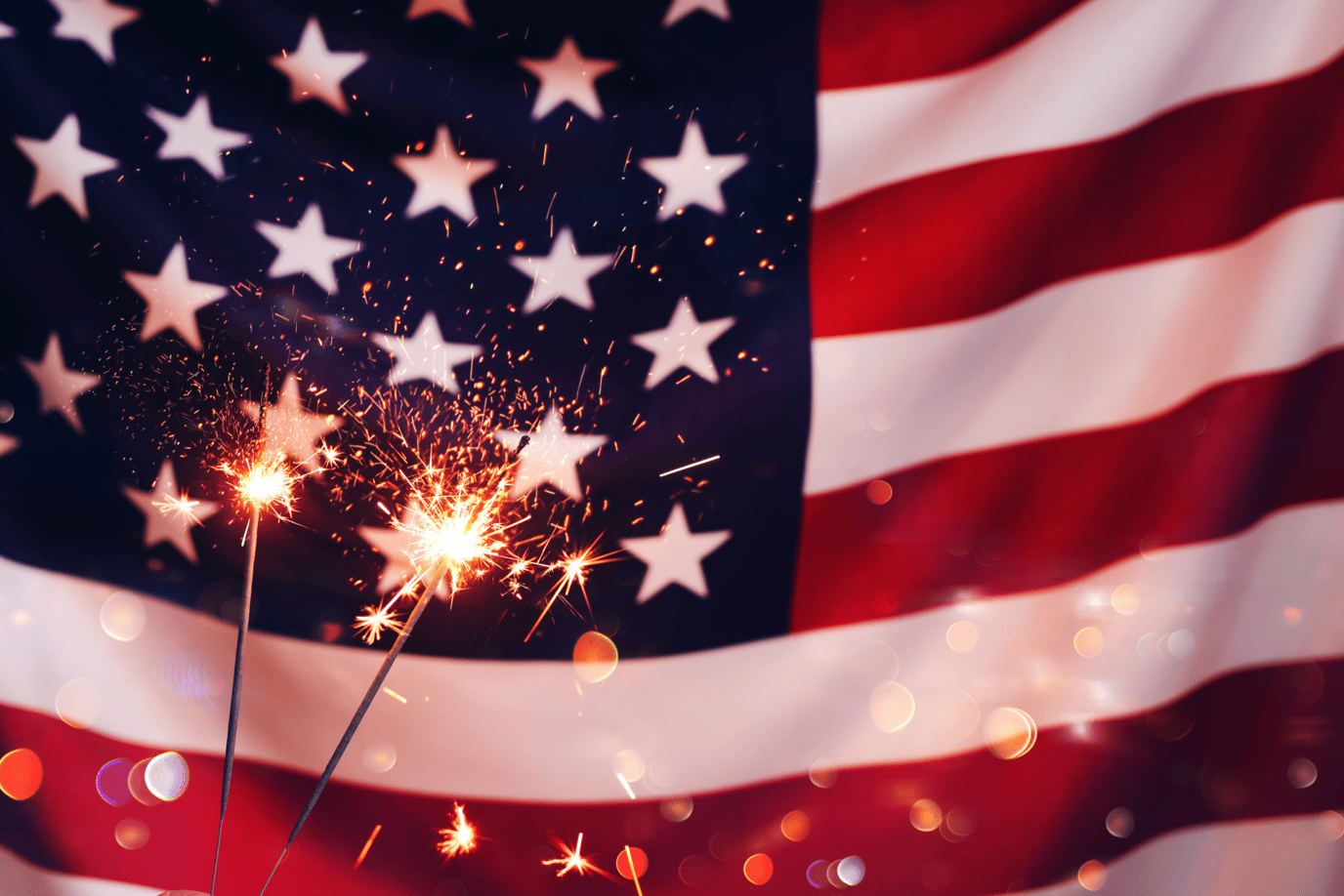 Sparklers in front of an American flag