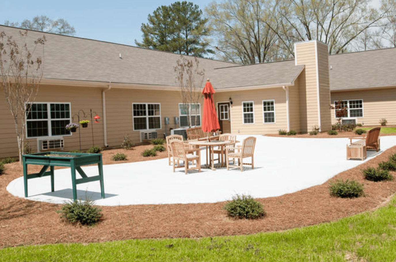 Outdoor patio area with seating and garden