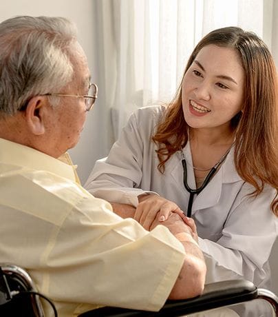 Healthcare worker assisting an elderly resident