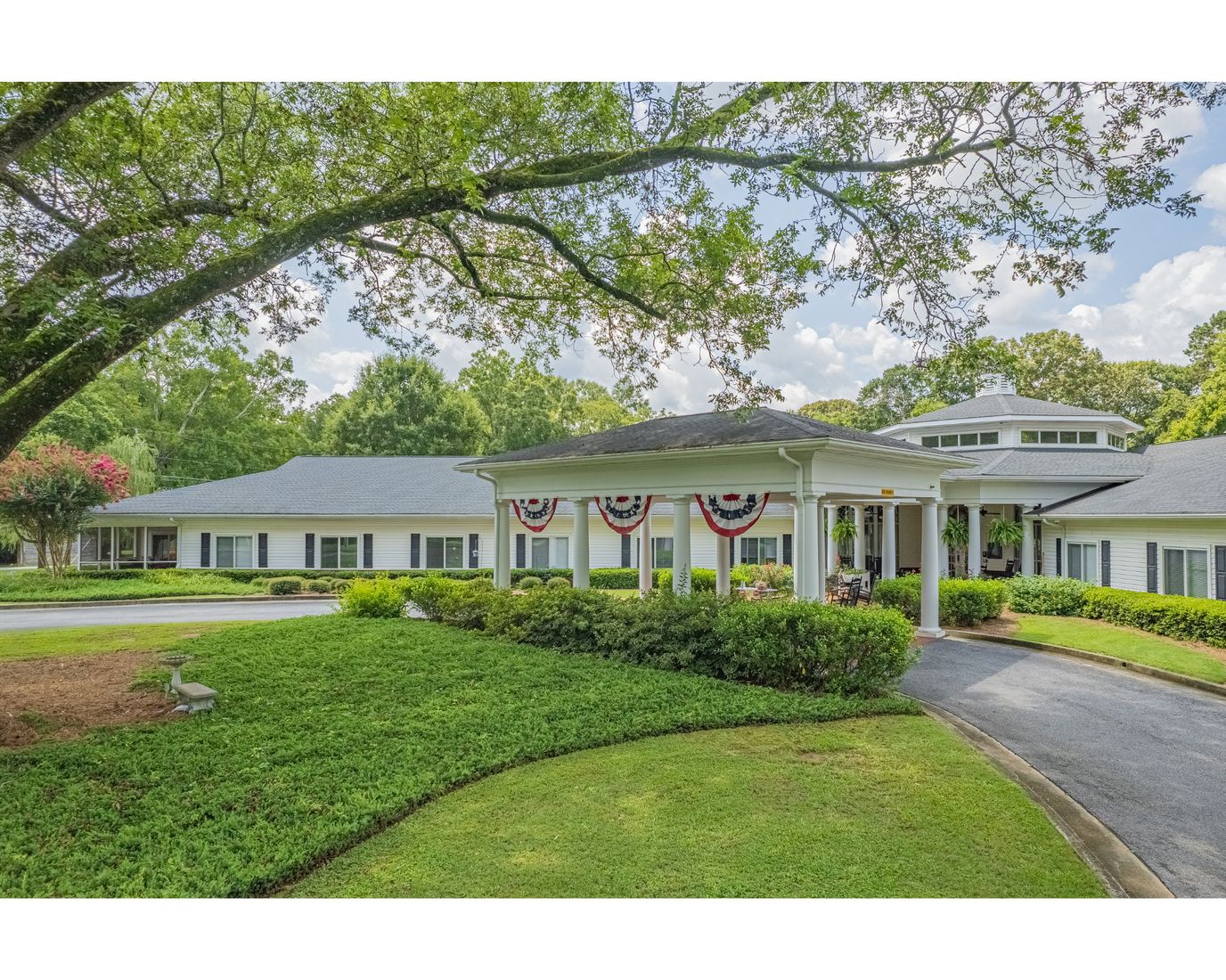 Exterior view of Mulberry Grove with landscaped grounds.