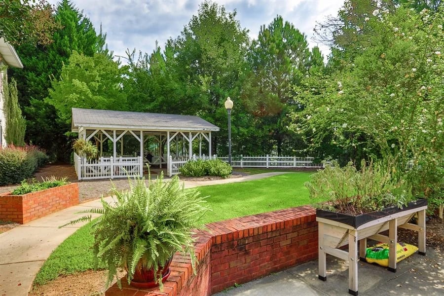 Garden area with a gazebo and greenery