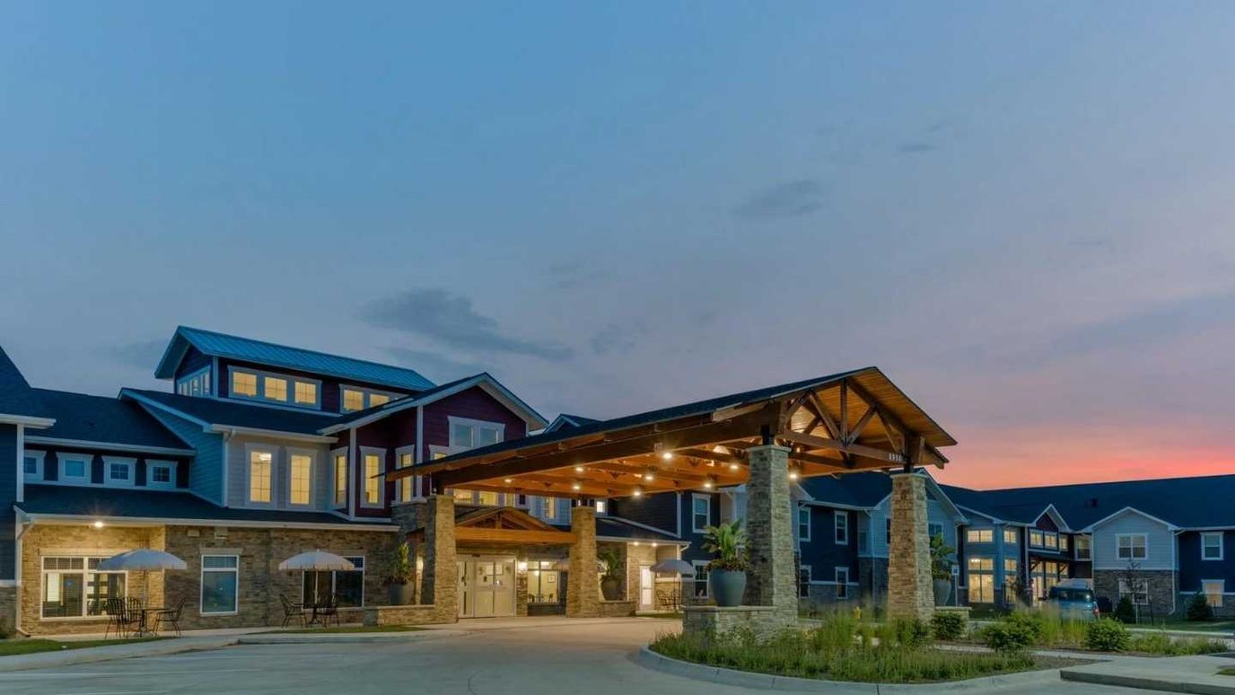 Exterior view of Cedar Ridge Village at dusk